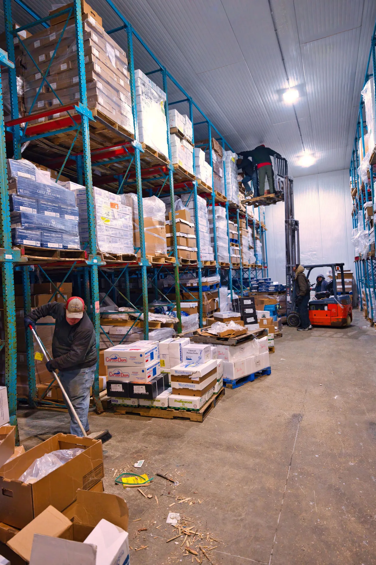 Crew and a forklift in the Water Street cold-storage warehouse